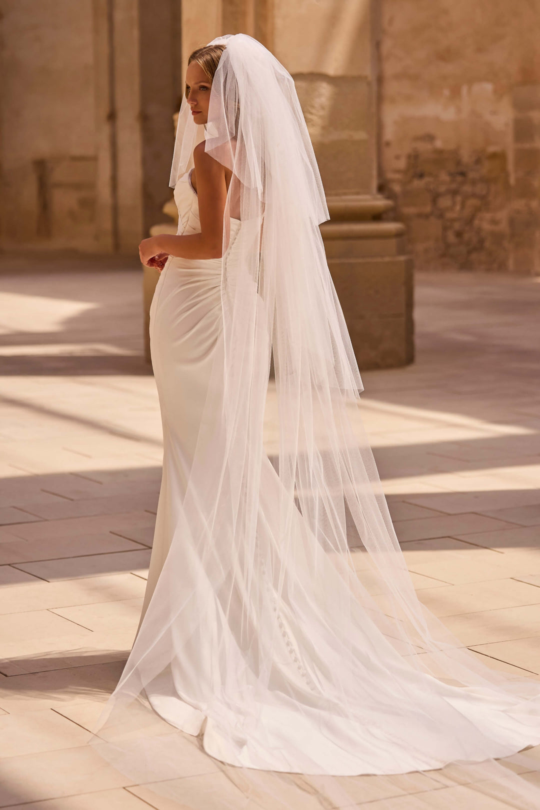 Elegant Fit &amp; Flare wedding dress with a defined waist and timeless design
