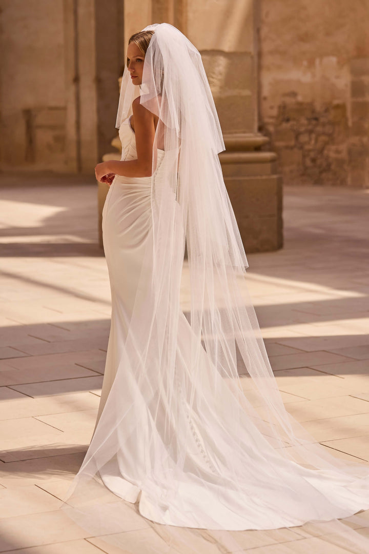 Elegant Fit &amp; Flare wedding dress with a defined waist and timeless design