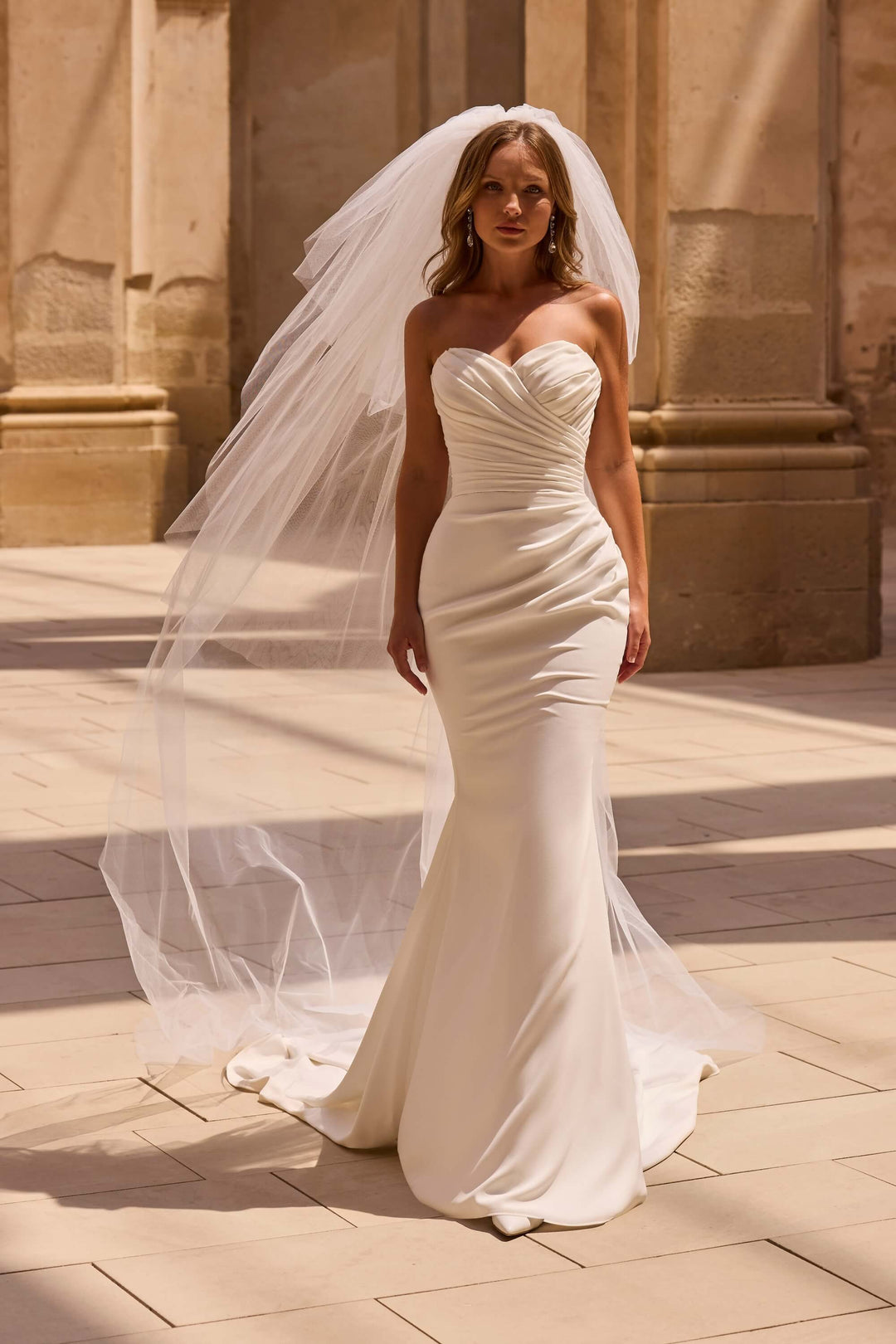 Elegant Fit &amp; Flare wedding dress with a defined waist and timeless design