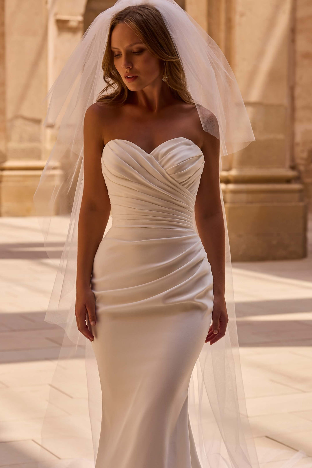 Elegant Fit &amp; Flare wedding dress with a defined waist and timeless design