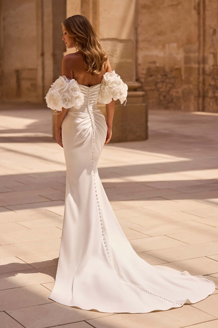 Elegant Fit &amp; Flare wedding dress with a defined waist and timeless design